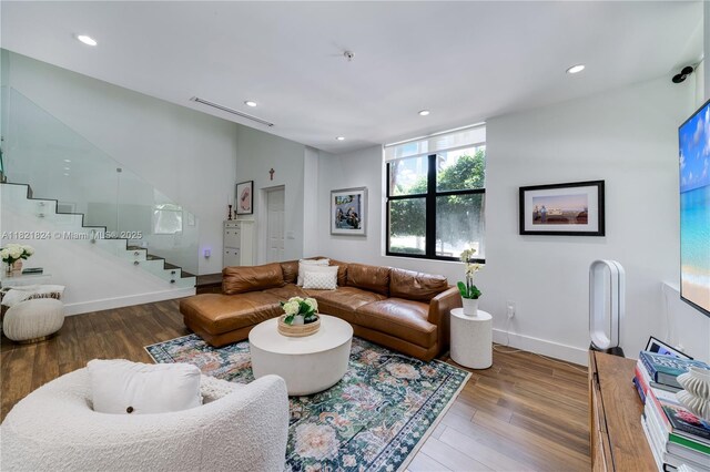 888 S Douglas Rd Unit 115, Coral Gables, FL 33134 - living room with stairs, wood finished floors, and recessed lighting