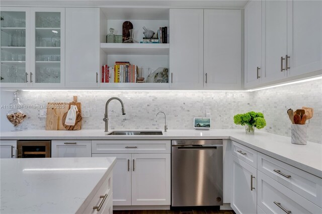 888 S Douglas Rd Unit 115, Coral Gables, FL 33134 - kitchen with stainless steel dishwasher, white cabinets, decorative backsplash, and open shelves