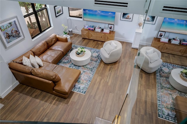 888 S Douglas Rd Unit 115, Coral Gables, FL 33134 - living area featuring baseboards and wood finished floors