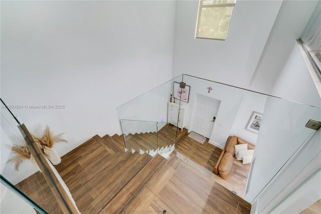 888 S Douglas Rd Unit 115, Coral Gables, FL 33134 - stairway with wood finished floors