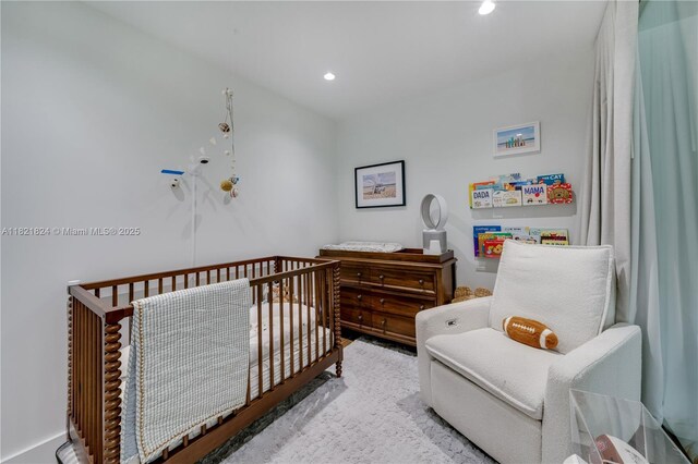888 S Douglas Rd Unit 115, Coral Gables, FL 33134 - bedroom featuring a crib and recessed lighting