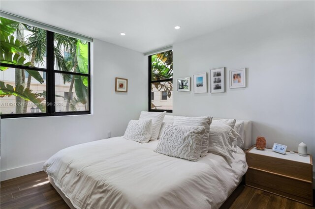 888 S Douglas Rd Unit 115, Coral Gables, FL 33134 - bedroom featuring wood finished floors, recessed lighting, and expansive windows