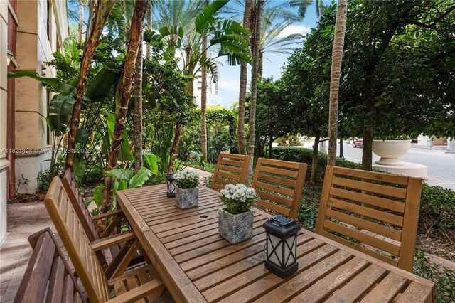 888 S Douglas Rd Unit 115, Coral Gables, FL 33134 - wooden deck with outdoor dining area
