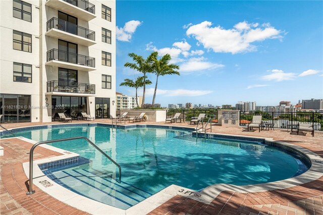 888 S Douglas Rd Unit 115, Coral Gables, FL 33134 - community pool with a patio