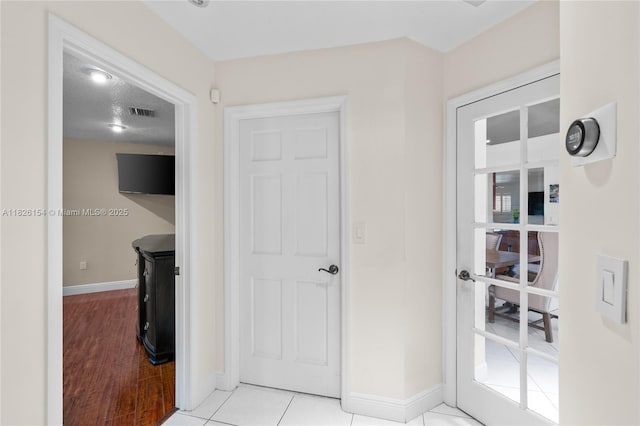 14288 SW 21st Ter, Miami, FL 33175 - hallway with baseboards and light wood-style flooring