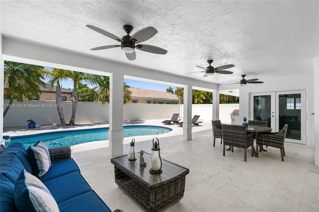 14288 SW 21st Ter, Miami, FL 33175 - view of swimming pool with french doors, a fenced backyard, a ceiling fan, and a patio