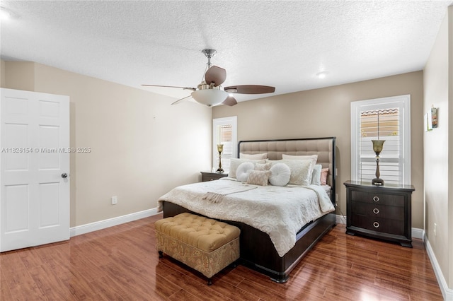 14288 SW 21st Ter, Miami, FL 33175 - bedroom with wood finished floors, a textured ceiling, and a ceiling fan