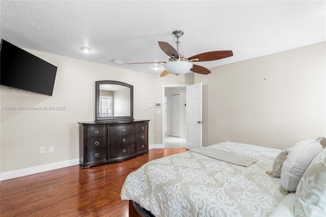 14288 SW 21st Ter, Miami, FL 33175 - bedroom featuring dark wood finished floors, a textured ceiling, and ceiling fan