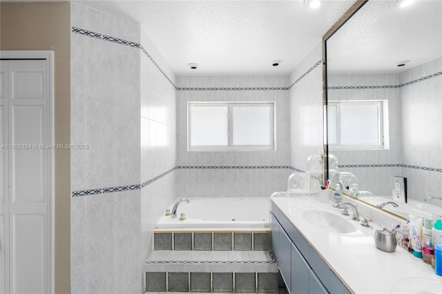 14288 SW 21st Ter, Miami, FL 33175 - bathroom with a jetted tub, double vanity, healthy amount of natural light, and a textured ceiling