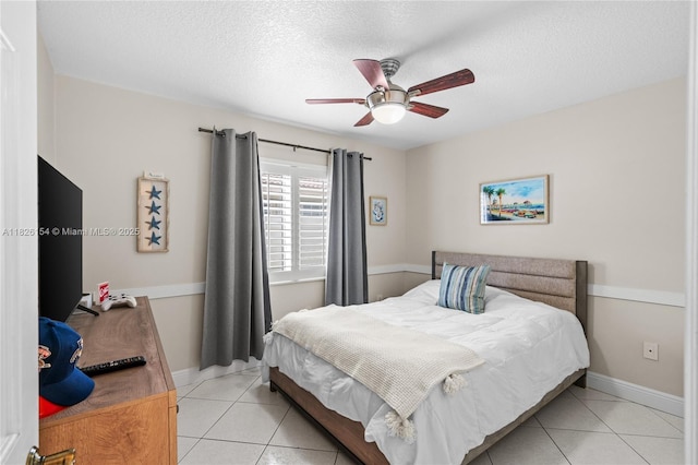 14288 SW 21st Ter, Miami, FL 33175 - bedroom with light tile patterned flooring, a textured ceiling, and a ceiling fan