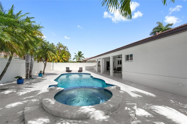 14288 SW 21st Ter, Miami, FL 33175 - view of pool with ceiling fan, a pool with connected hot tub, a patio area, and a fenced backyard