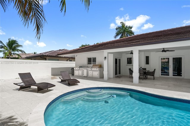 14288 SW 21st Ter, Miami, FL 33175 - view of swimming pool featuring exterior kitchen, french doors, ceiling fan, and a patio area