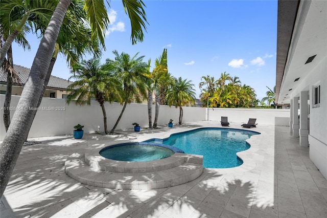 14288 SW 21st Ter, Miami, FL 33175 - view of swimming pool with a fenced backyard, a pool with connected hot tub, and a patio