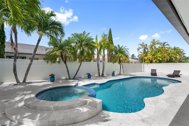 14288 SW 21st Ter, Miami, FL 33175 - view of pool with a fenced backyard, a pool with connected hot tub, and a patio area