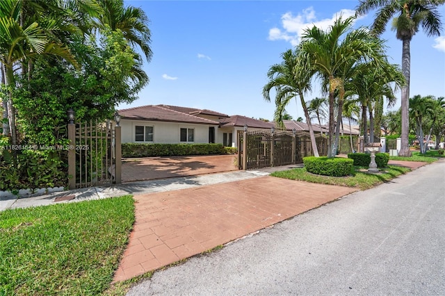 14288 SW 21st Ter, Miami, FL 33175 - ranch-style house with a gate, stucco siding, and a tiled roof