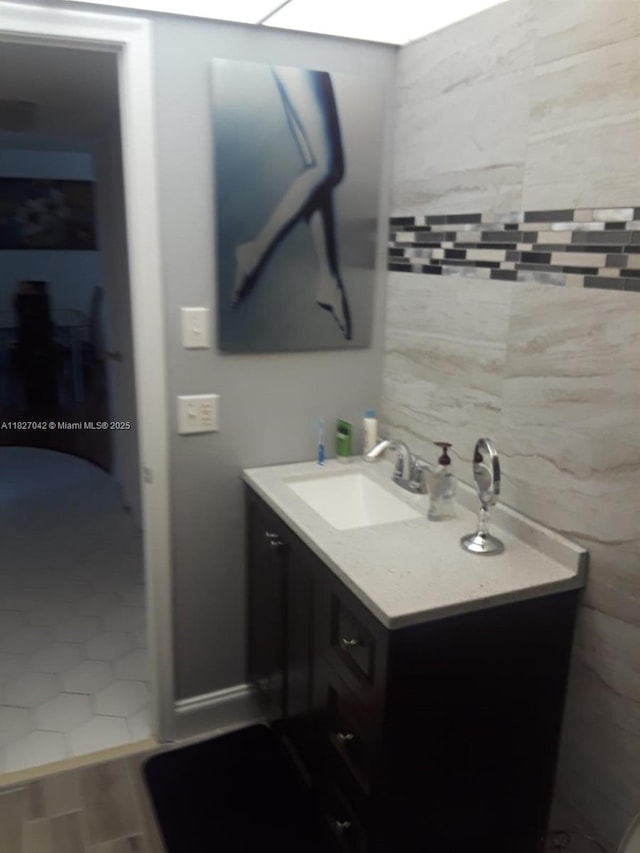 900 NE 12th Ave Unit 302, Hallandale Beach, FL 33009 - bathroom with vanity and tile walls