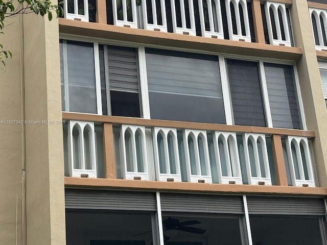 900 NE 12th Ave Unit 302, Hallandale Beach, FL 33009 - view of side of home with an attached garage and a balcony