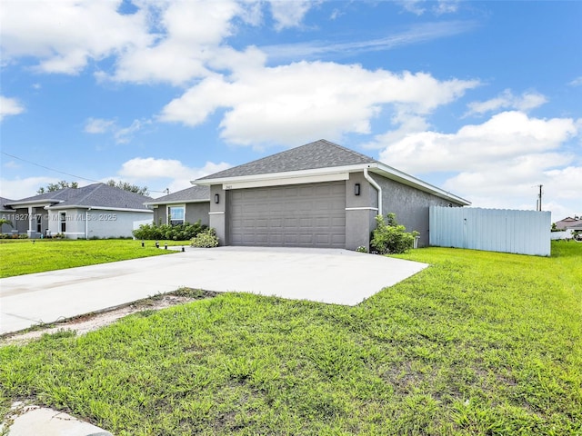 2405 Nelson Rd, Cape Coral, FL 33993 - view of home's exterior featuring an attached garage, stucco siding, and concrete driveway