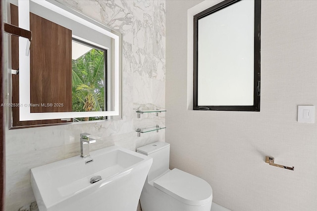 1311 Stillwater Dr, Miami Beach, FL 33141 - half bath with tile walls and a sink