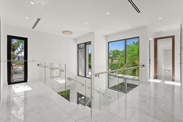 1311 Stillwater Dr, Miami Beach, FL 33141 - bedroom featuring marble tiled floors and recessed lighting