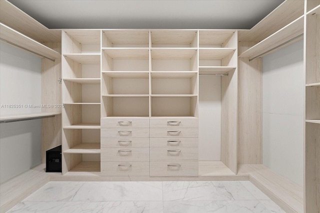 1311 Stillwater Dr, Miami Beach, FL 33141 - walk in closet with marble look tiles