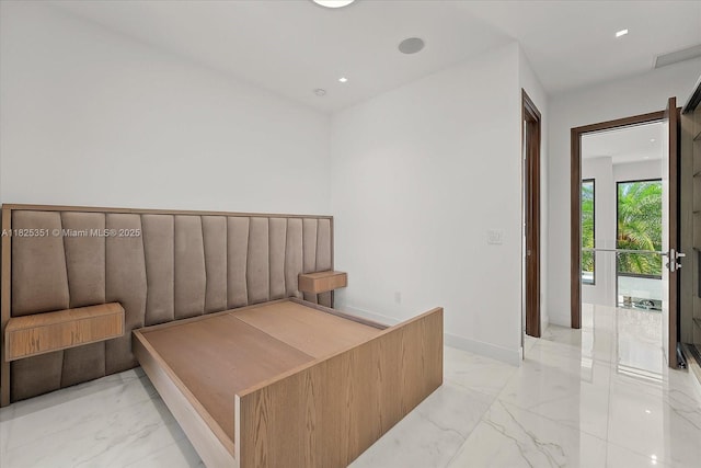 1311 Stillwater Dr, Miami Beach, FL 33141 - unfurnished bedroom with light marble finish floors and baseboards