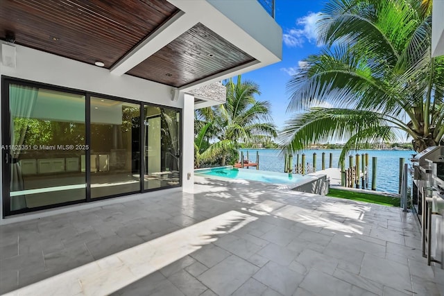1311 Stillwater Dr, Miami Beach, FL 33141 - view of patio / terrace featuring a water view and an outdoor pool