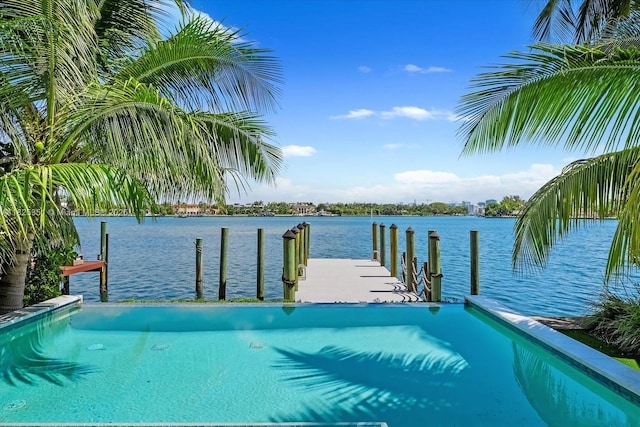 1311 Stillwater Dr, Miami Beach, FL 33141 - view of swimming pool featuring a boat dock and a water view
