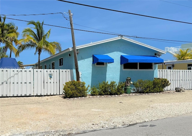 211 Banyan Ln, Tavernier, FL 33070 - view of front of home featuring stucco siding
