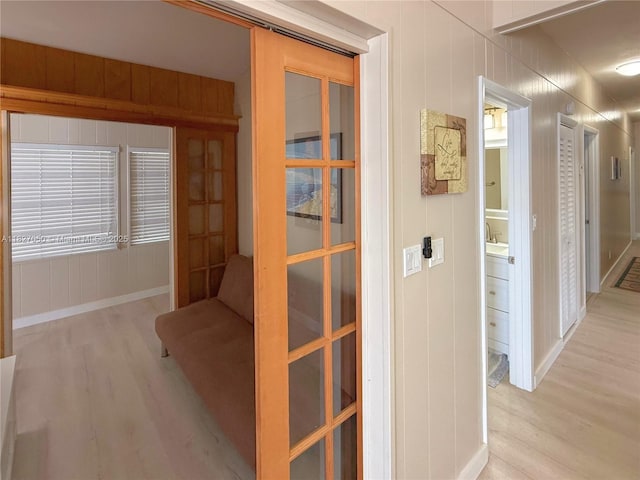 211 Banyan Ln, Tavernier, FL 33070 - corridor featuring light wood finished floors
