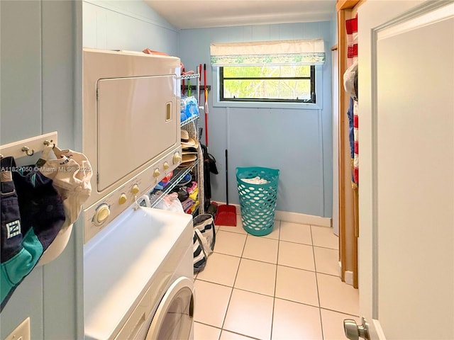 211 Banyan Ln, Tavernier, FL 33070 - laundry room with estacked washer and dryer and tile patterned floors