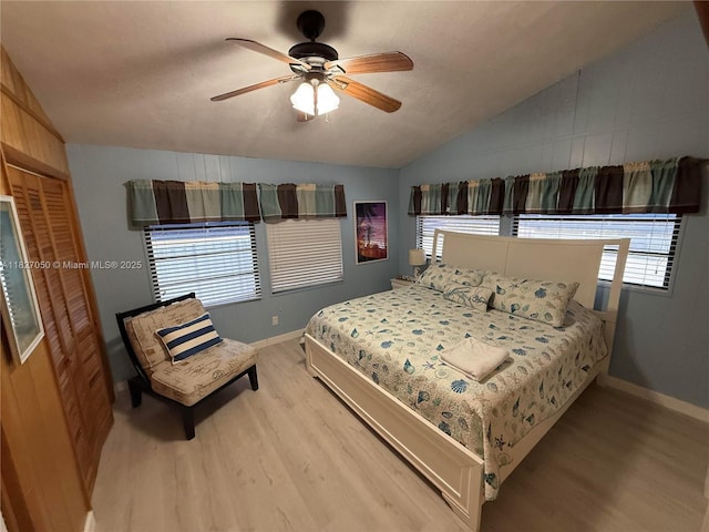 211 Banyan Ln, Tavernier, FL 33070 - bedroom with vaulted ceiling, wood finished floors, and a ceiling fan