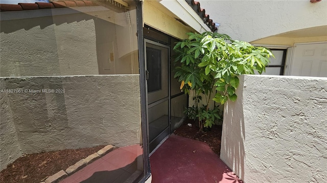 1105 San Remo Cir, Homestead, FL 33035 - property entrance with a tile roof and stucco siding