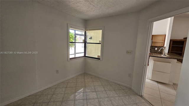 1105 San Remo Cir, Homestead, FL 33035 - empty room with a textured ceiling and light tile patterned floors