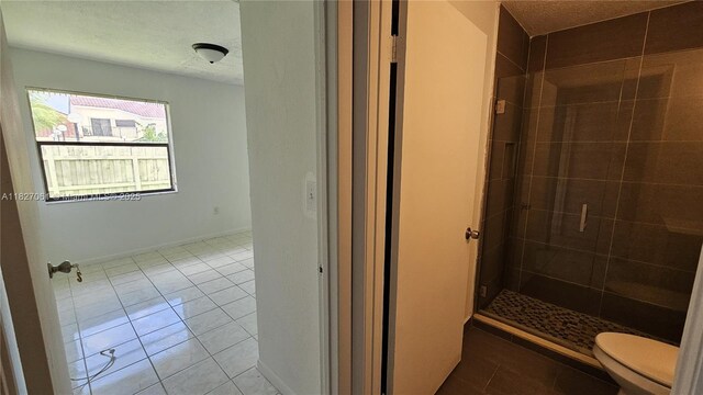 1105 San Remo Cir, Homestead, FL 33035 - full bathroom featuring tile patterned flooring, a stall shower, and a textured ceiling