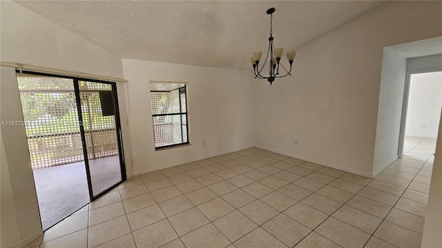 1105 San Remo Cir, Homestead, FL 33035 - unfurnished room featuring light tile patterned floors, a chandelier, and a textured ceiling