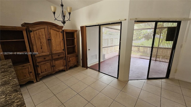 1105 San Remo Cir, Homestead, FL 33035 - unfurnished dining area featuring a chandelier and light tile patterned flooring