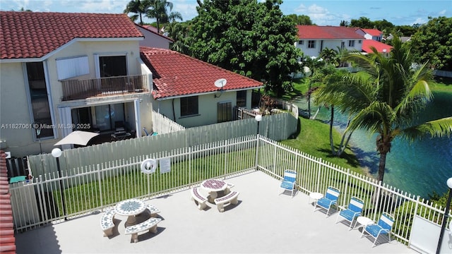 1105 San Remo Cir, Homestead, FL 33035 - patio / terrace with a patio area, a fire pit, and a fenced backyard