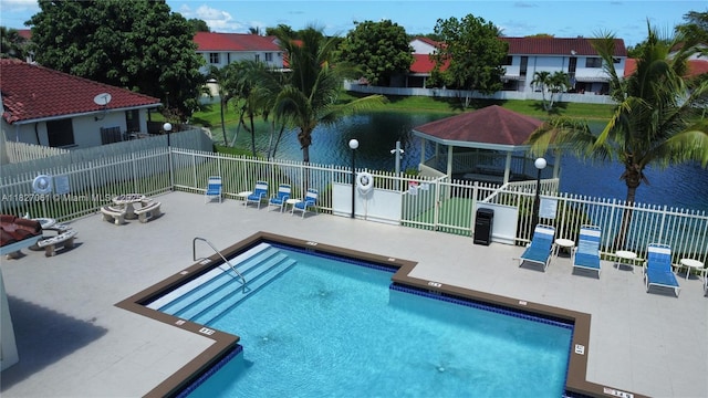 1105 San Remo Cir, Homestead, FL 33035 - community pool with a patio area and a water view