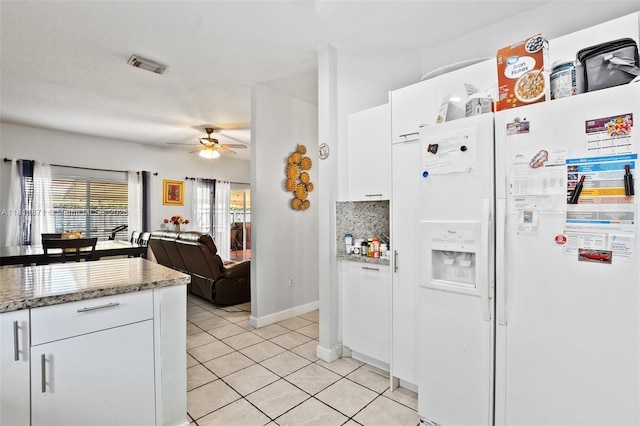 13011 SW 143rd Ter, Miami, FL 33186 - kitchen with white refrigerator with ice dispenser, white cabinetry, light tile patterned flooring, a ceiling fan, and open floor plan