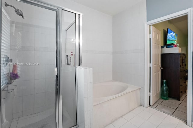 13011 SW 143rd Ter, Miami, FL 33186 - bathroom with a bath, a stall shower, and tile patterned flooring