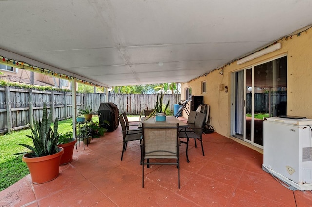 13011 SW 143rd Ter, Miami, FL 33186 - fenced backyard featuring a patio, grilling area, and outdoor dining space