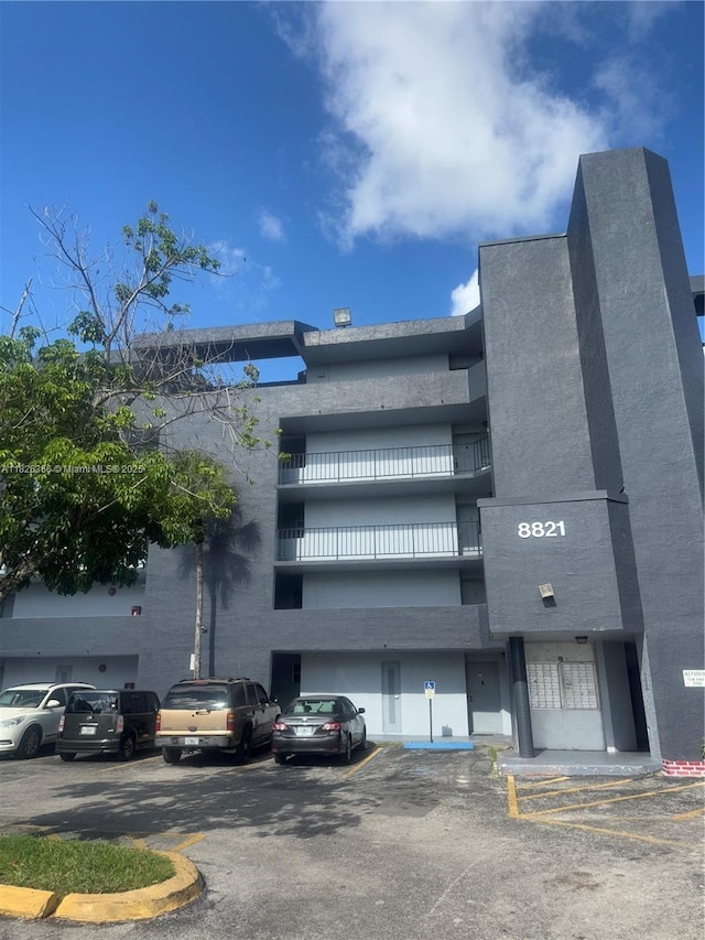 8821 W Flagler St Unit 108, Miami, FL 33174 - view of building exterior with uncovered parking