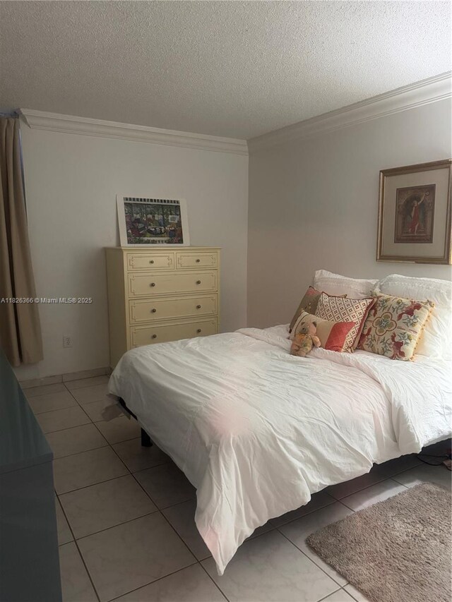 8821 W Flagler St Unit 108, Miami, FL 33174 - tiled bedroom featuring crown molding and a textured ceiling