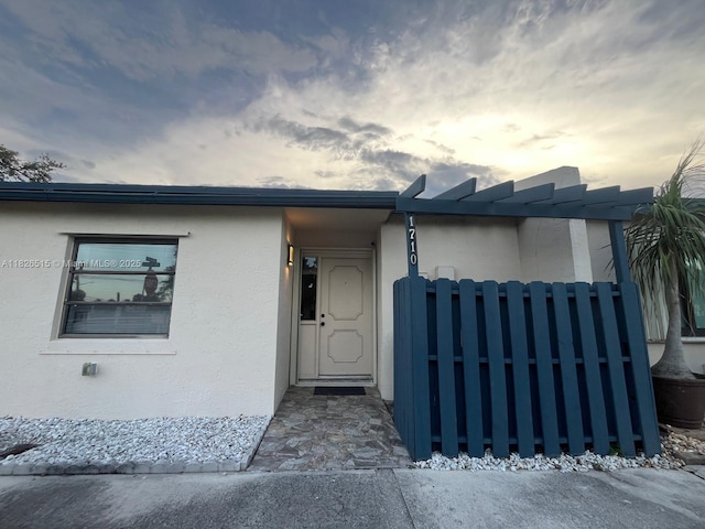 1710 NW 92nd Ave, Pembroke Pines, FL 33024 - view of exterior entry featuring stucco siding
