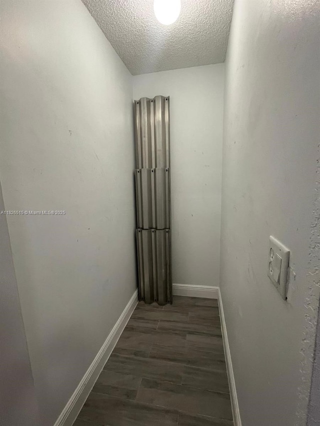 1710 NW 92nd Ave, Pembroke Pines, FL 33024 - corridor with a textured ceiling and wood finished floors