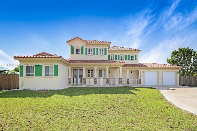 32157 SW 207th Ave, Homestead, FL 33030 - mediterranean / spanish-style home with an attached garage, stucco siding, driveway, and a tile roof