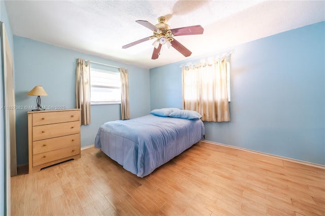 5103 NW 54th Ct, Tamarac, FL 33319 - bedroom featuring wood finished floors and a ceiling fan