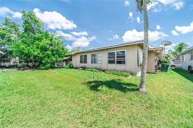 5103 NW 54th Ct, Tamarac, FL 33319 - rear view of house featuring a lawn and stucco siding