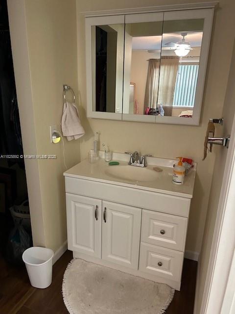 9841 Sunrise Lakes Blvd Unit 310, Sunrise, FL 33322 - bathroom featuring vanity and wood finished floors